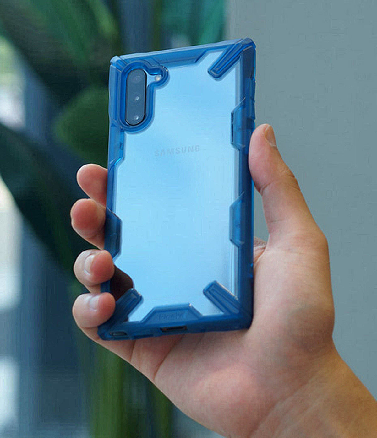 Galaxy Note 10 Case | Fusion-X - A hand holding a blue transparent protective phone case on a Samsung Galaxy Note 10.