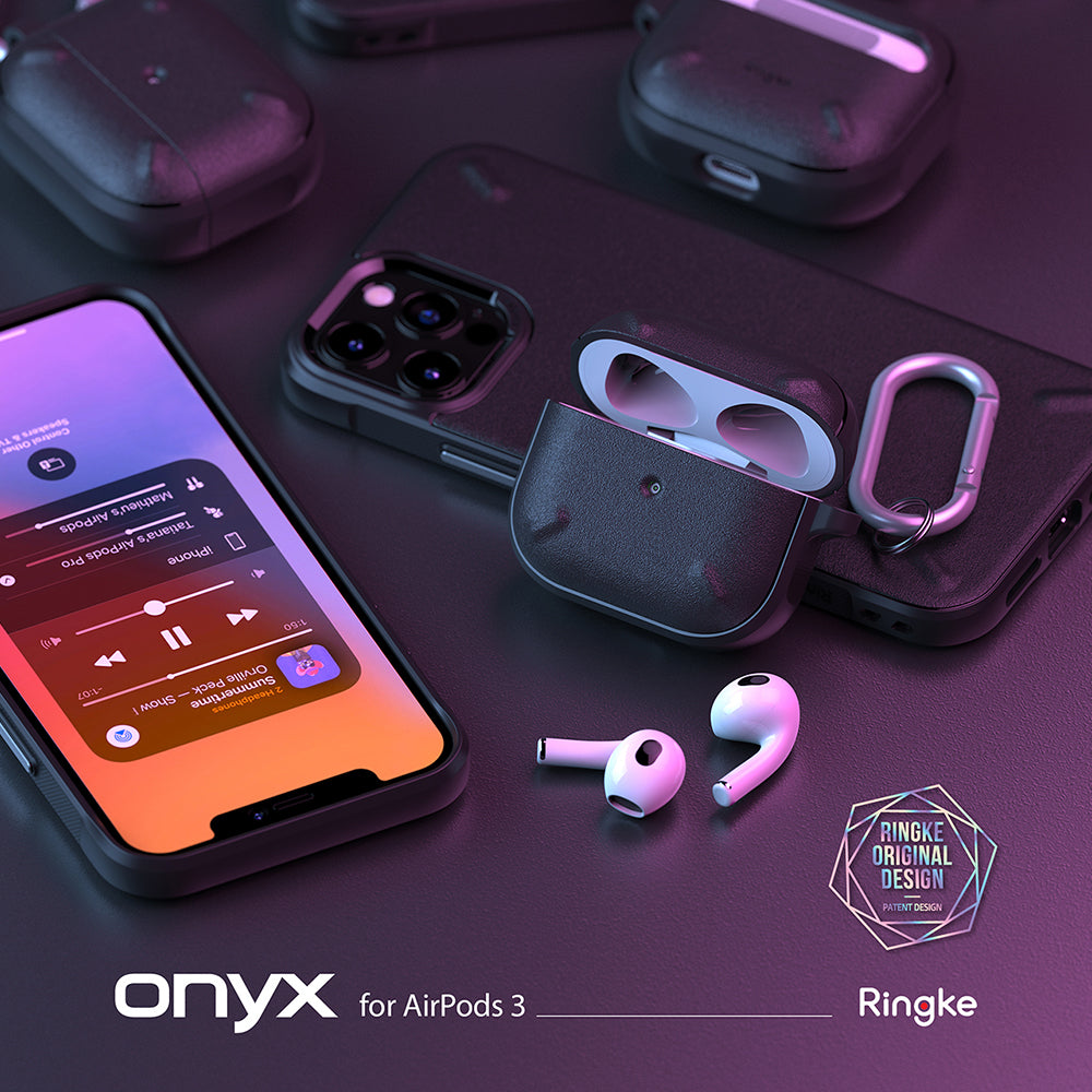 AirPods 3 Case | Onyx - Black textured AirPods 3 case with carabiner, smartphone, and earbuds on a dark purple surface.