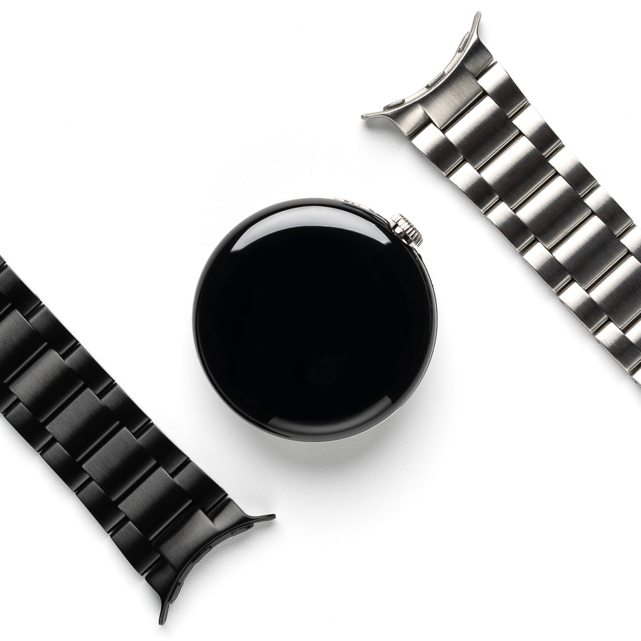 Google Pixel Watch | Metal One Band - Black watch face centered between a matte black and a brushed silver metal link band.