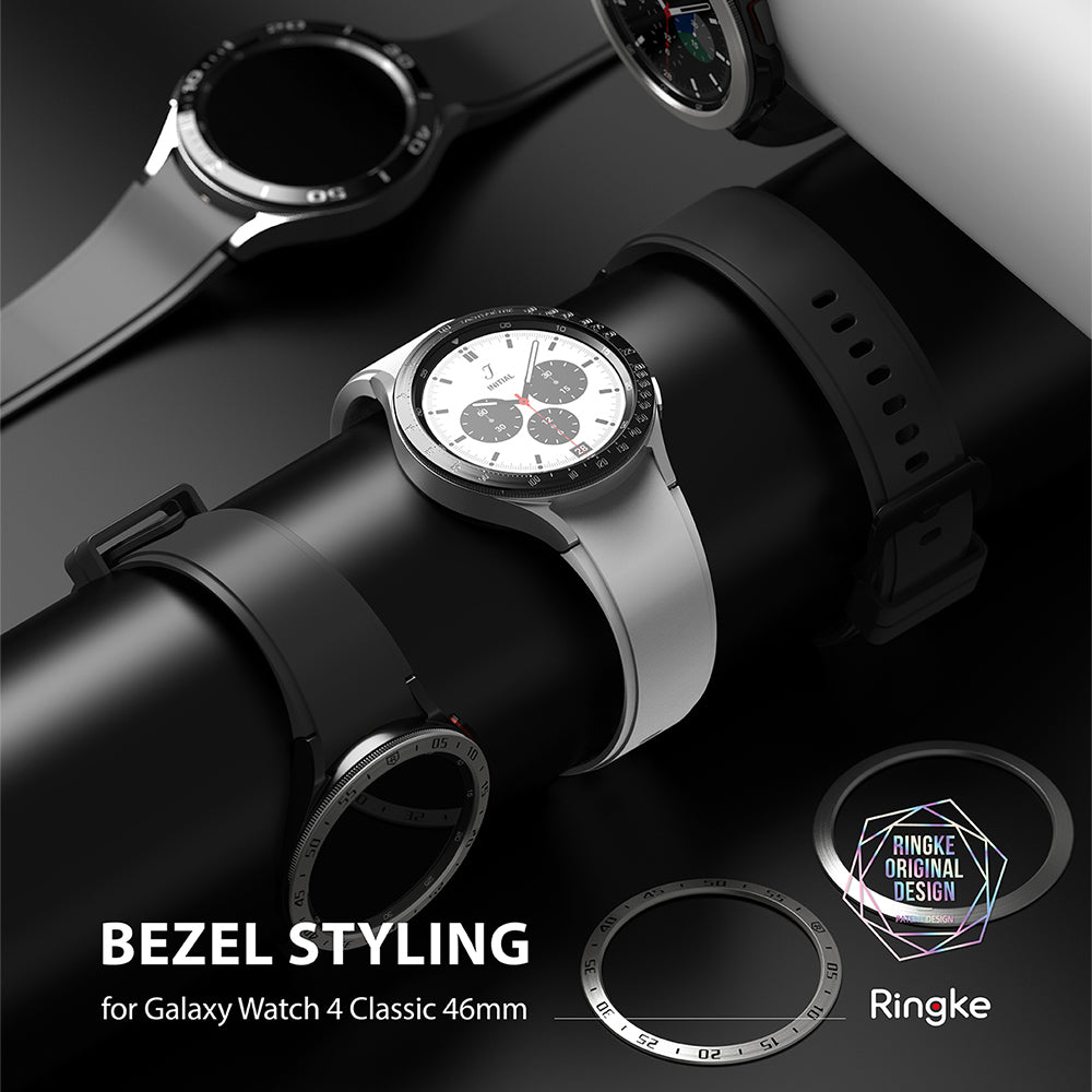 Galaxy Watch 4 Classic 46mm | Bezel Styling - Galaxy Watch 4 Classic 46mm - Three smartwatches with different metallic bezel styling rings displayed on a black stand.