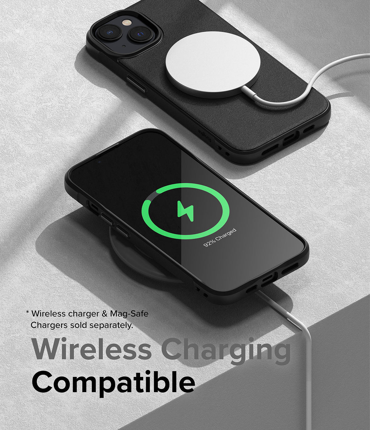 iPhone 14 Case | Onyx - Black iPhone 14 in an Onyx case charging wirelessly with a MagSafe puck and a charging pad.