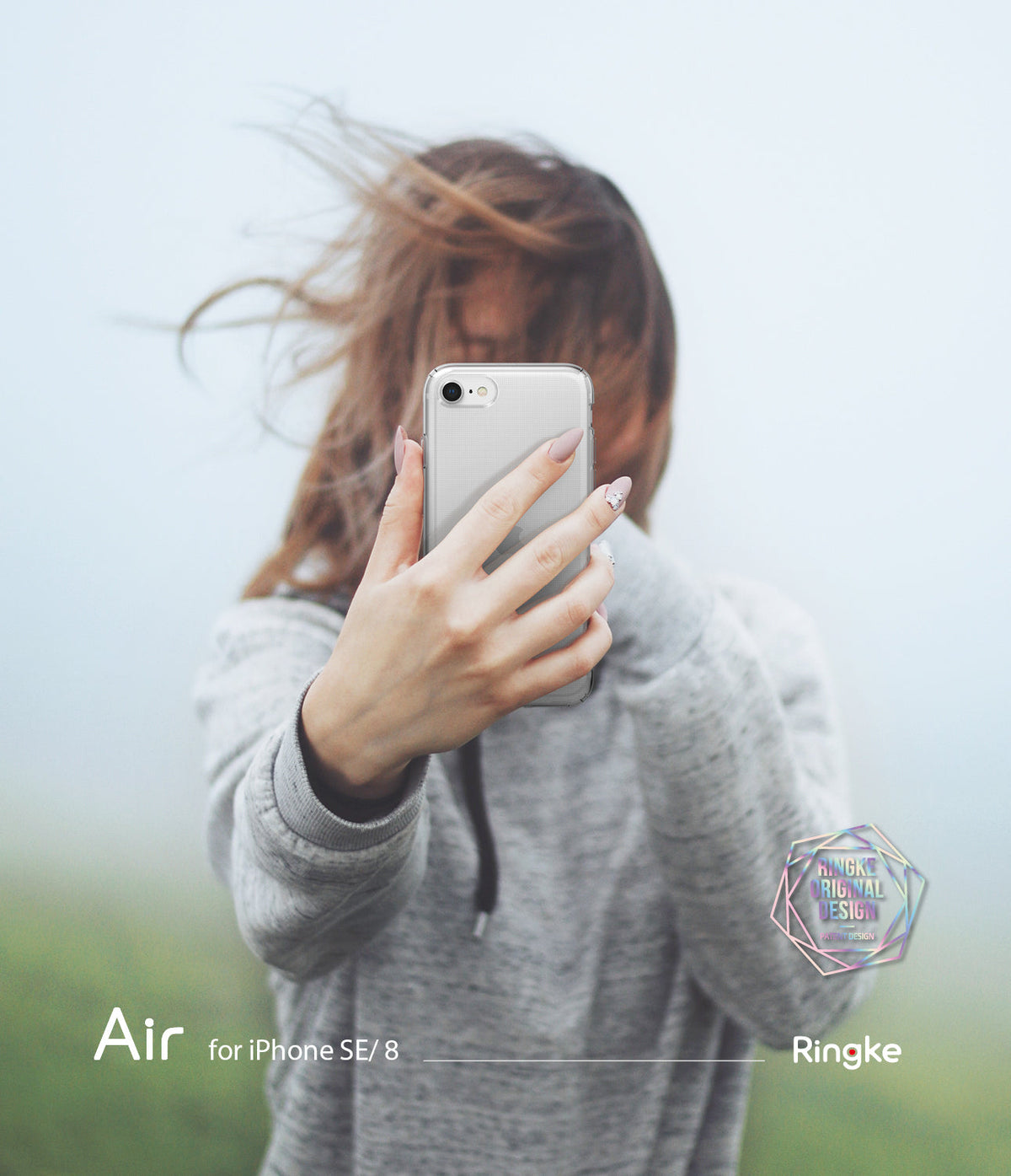 iPhone SE 2022 5G / SE 2020 / 8 Case | Air - Person holding a clear phone case over their face against a misty background.