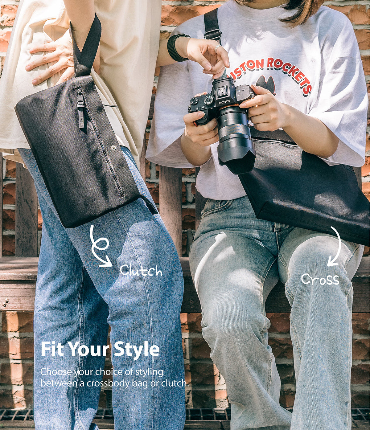 2-Way Bag - Two people demonstrating a black bag worn as a clutch and a crossbody bag while sitting on a brick bench.