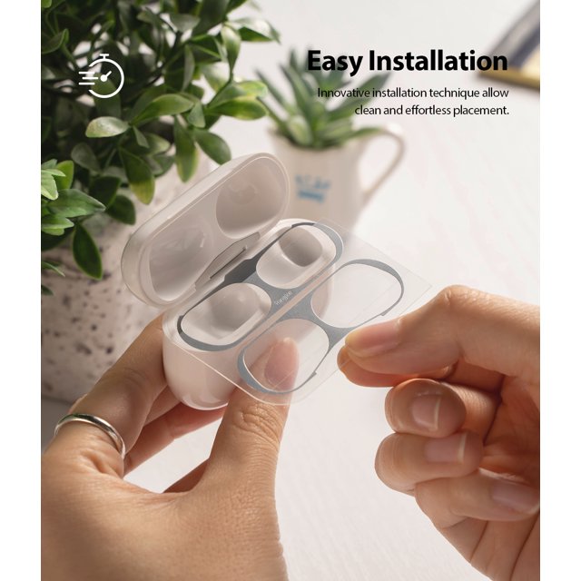 Ringke Airpods Pro Dust Guard Sticker - Hands applying a metallic dust guard sticker to an open AirPods Pro charging case.