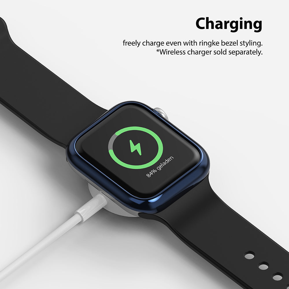 Apple Watch Series 6 / 5 / 4 / SE (44mm) | Bezel Styling - Apple Watch with blue bezel styling charging on a wireless puck.