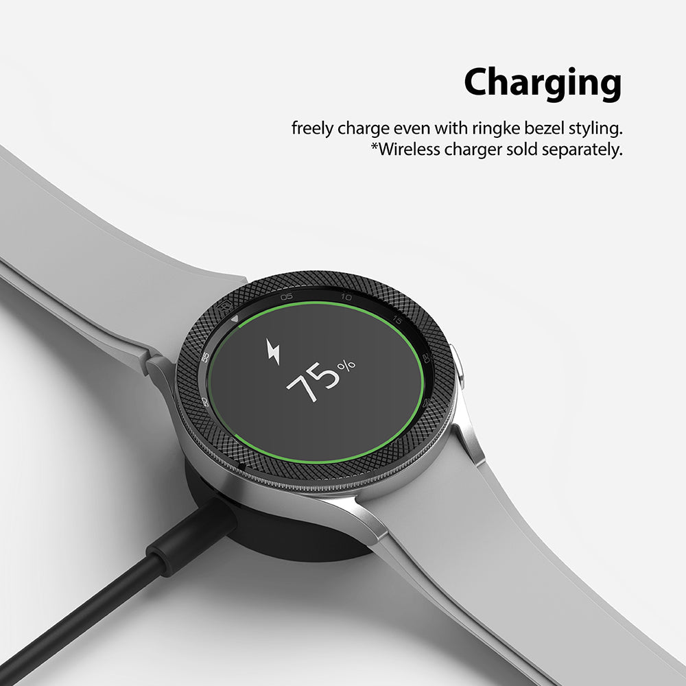 Galaxy Watch 4 Classic 46mm | Bezel Styling - Smartwatch with textured bezel accessory charging on a wireless dock.