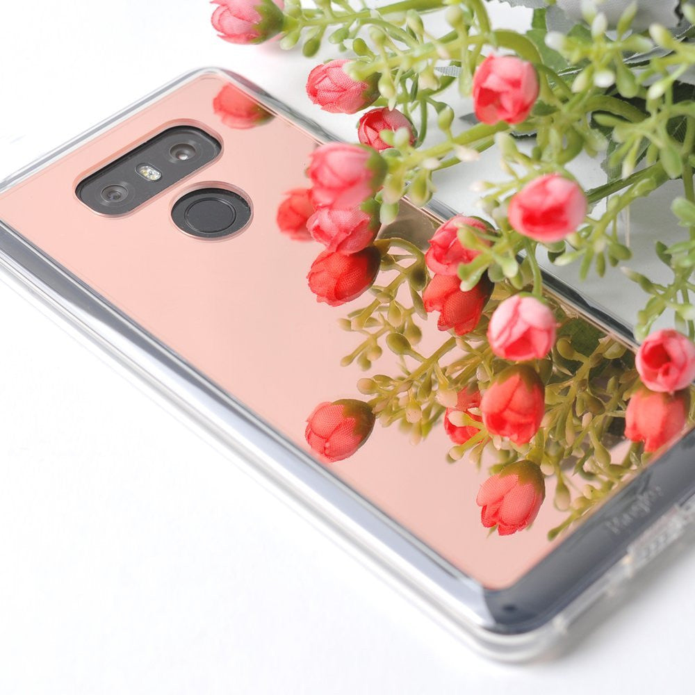 LG G6 Case | Mirror - Rose gold reflective phone case reflecting a bouquet of small pink flowers on a white surface.
