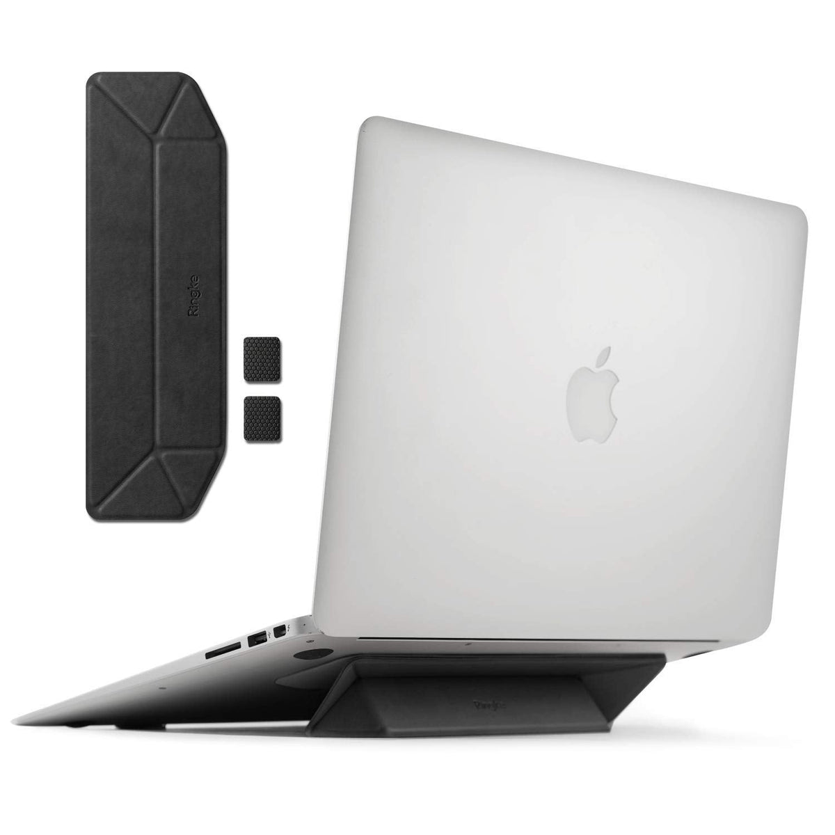 Laptop Stand - A foldable black adhesive laptop stand attached to a silver laptop, with extra pieces shown separately.