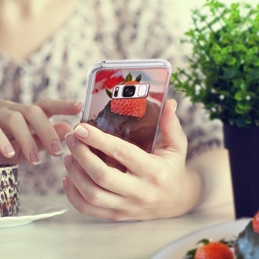 Galaxy S8 Case | Mirror - Hands holding a phone with a reflective case showing a chocolate cupcake with a strawberry.