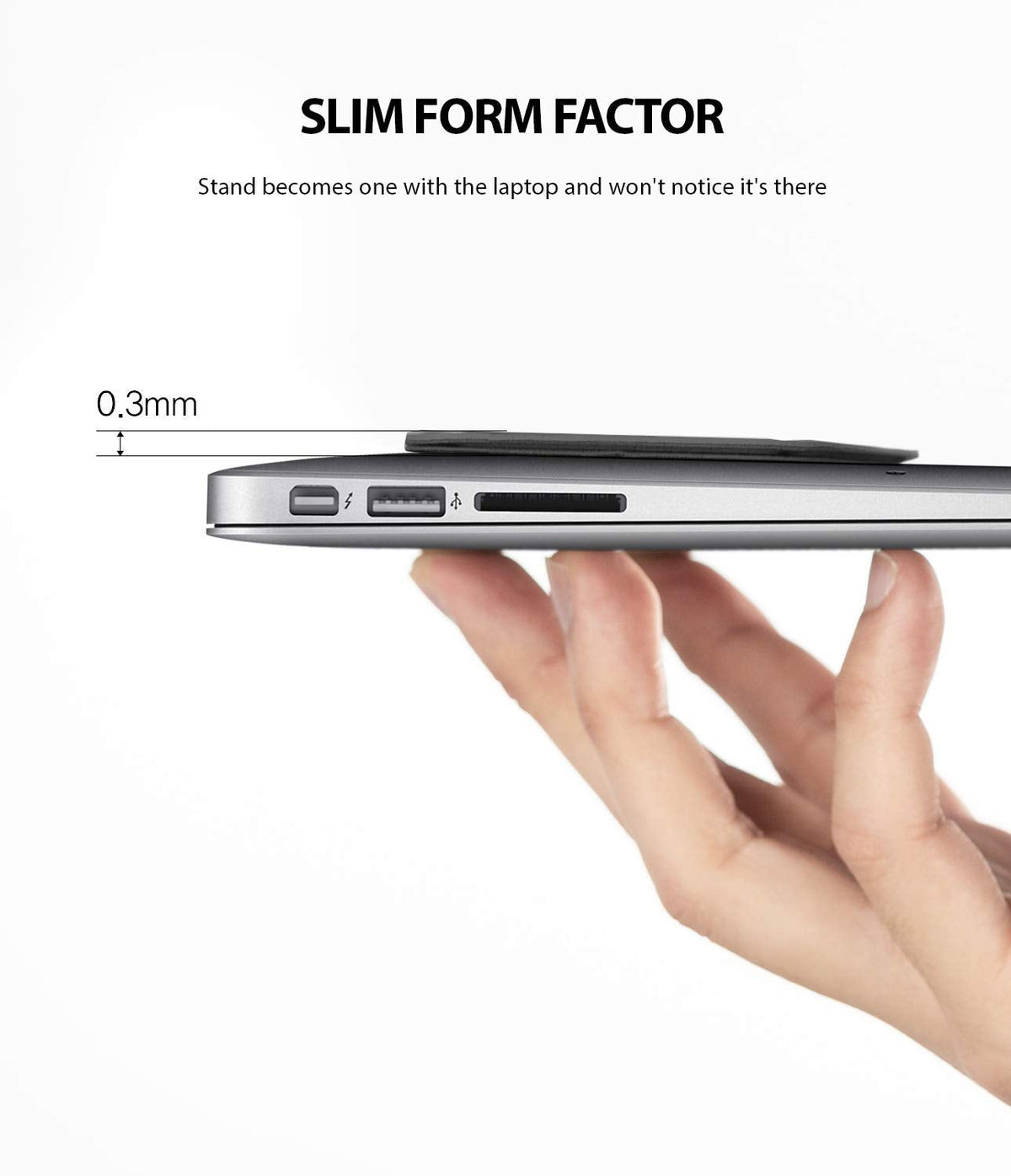 Laptop Stand - A hand holds a laptop with a 0.3mm thin adhesive stand attached to the bottom.
