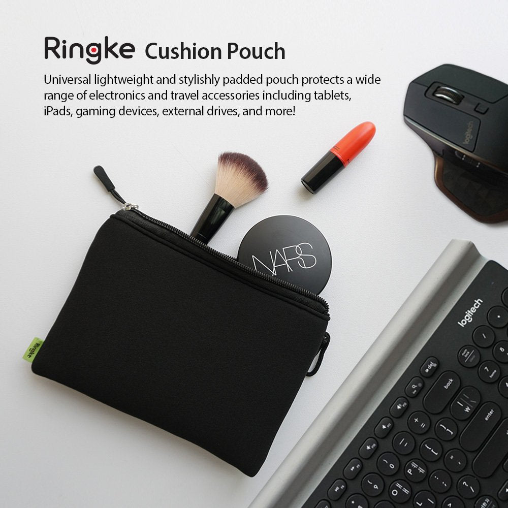 Cushion Pouch - Black zippered pouch containing makeup brush and compact, next to a computer mouse and keyboard.