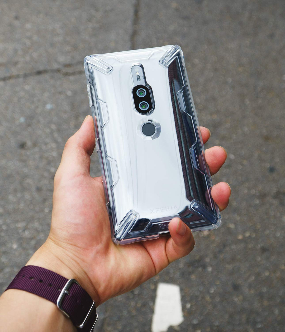 Xperia XZ2 Premium Case | Air-X - A hand holding a silver Xperia phone in a clear, reinforced protective case.