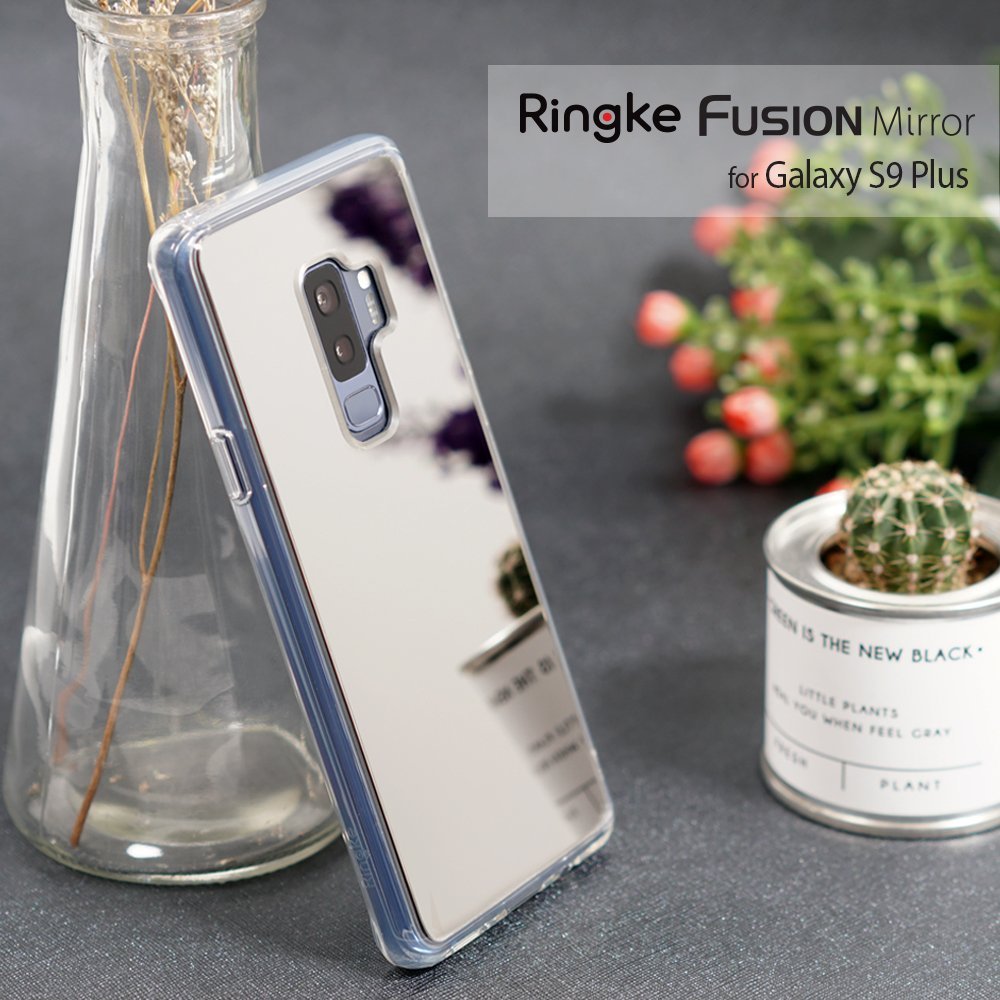 Galaxy S9 Plus Case | Mirror - Silver - Reflective silver phone case leaning against a glass vase with a small cactus nearby.