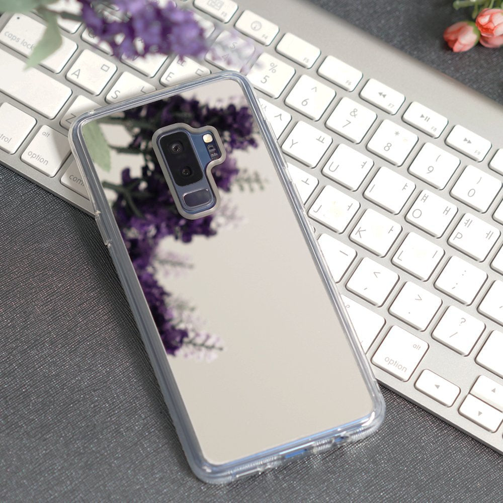Galaxy S9 Plus Case | Mirror - Silver - Silver mirrored phone case reflecting purple flowers on a white keyboard.