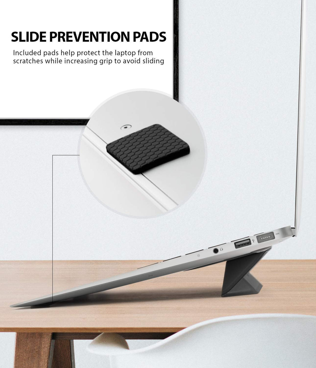 Laptop Stand - Close-up of a textured black anti-slip pad on a laptop stand to prevent scratching and sliding.
