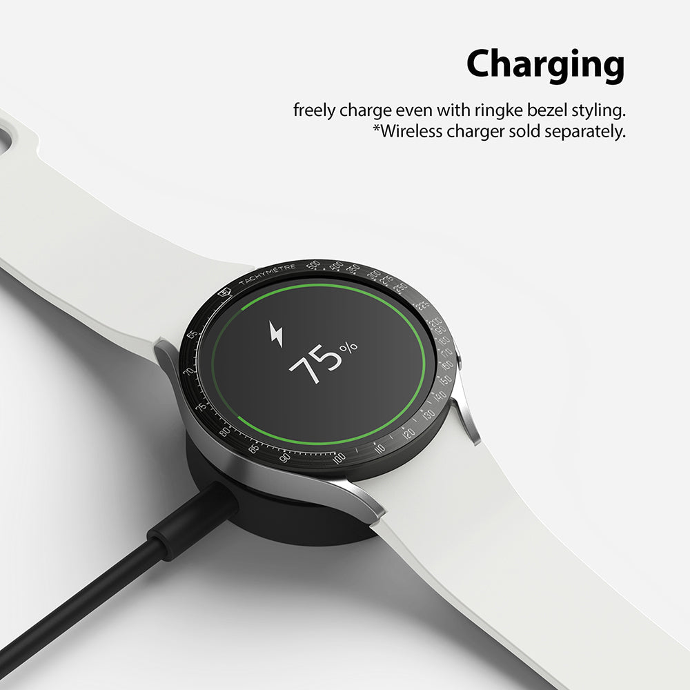 Galaxy Watch 5/4 40mm | Bezel Styling - Smartwatch with black bezel styling charging on a wireless dock at 75% battery.