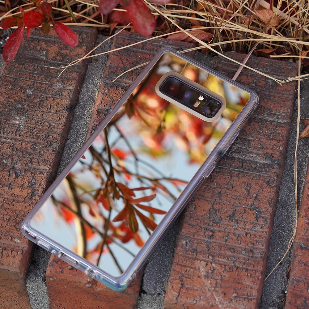 Galaxy Note 8 Case | Mirror - Reflective phone case on brick surface showing a mirror image of autumn leaves and branches.
