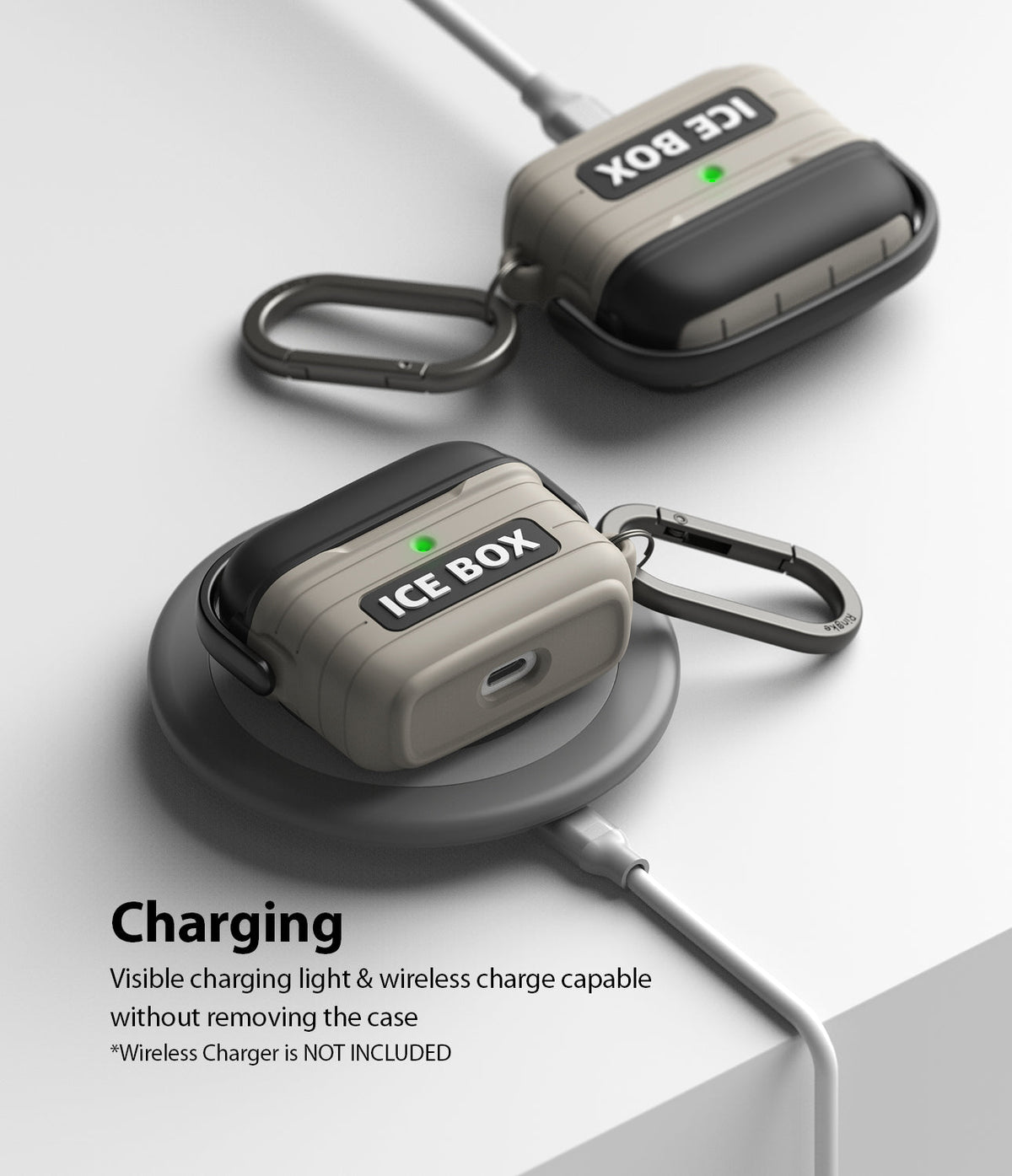 AirPods 3 Silicone Case | Ice Box - Two-tone beige and black AirPods cases with carabiners charging on a wireless pad.