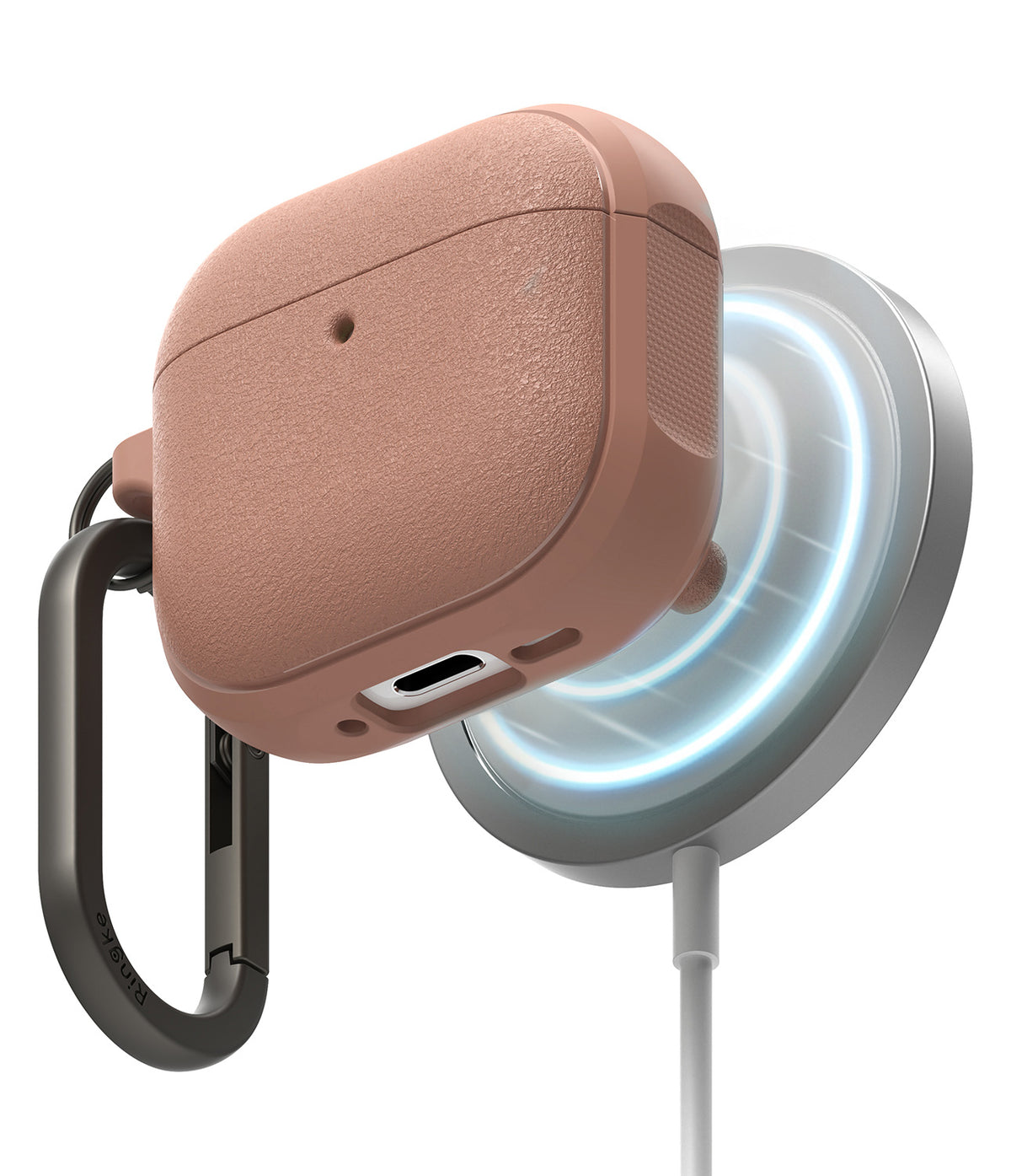 AirPods 5 / 4 Case | Onyx Magnetic - Textured rose-gold AirPods 4 case magnetically attached to a wireless charger with a black carabiner.