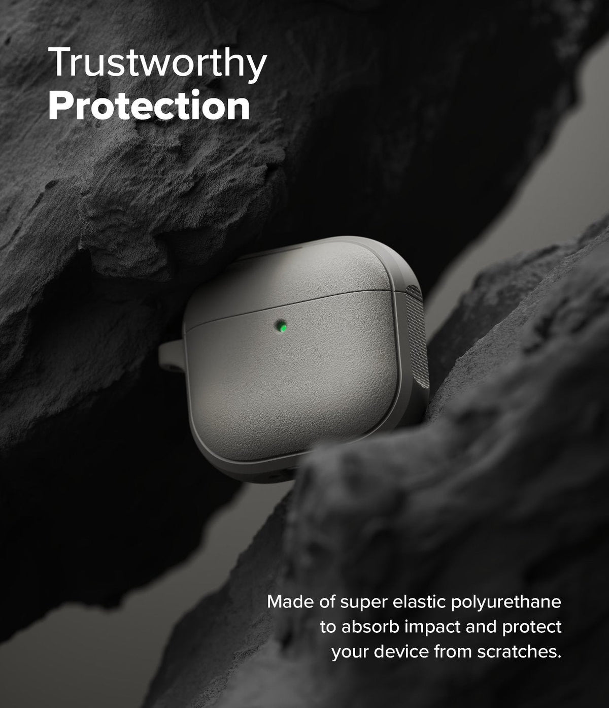 AirPods 5 / 4 Case | Onyx Magnetic - Grey AirPods 4 case with a glowing green light nestled between dark, rugged rock formations.