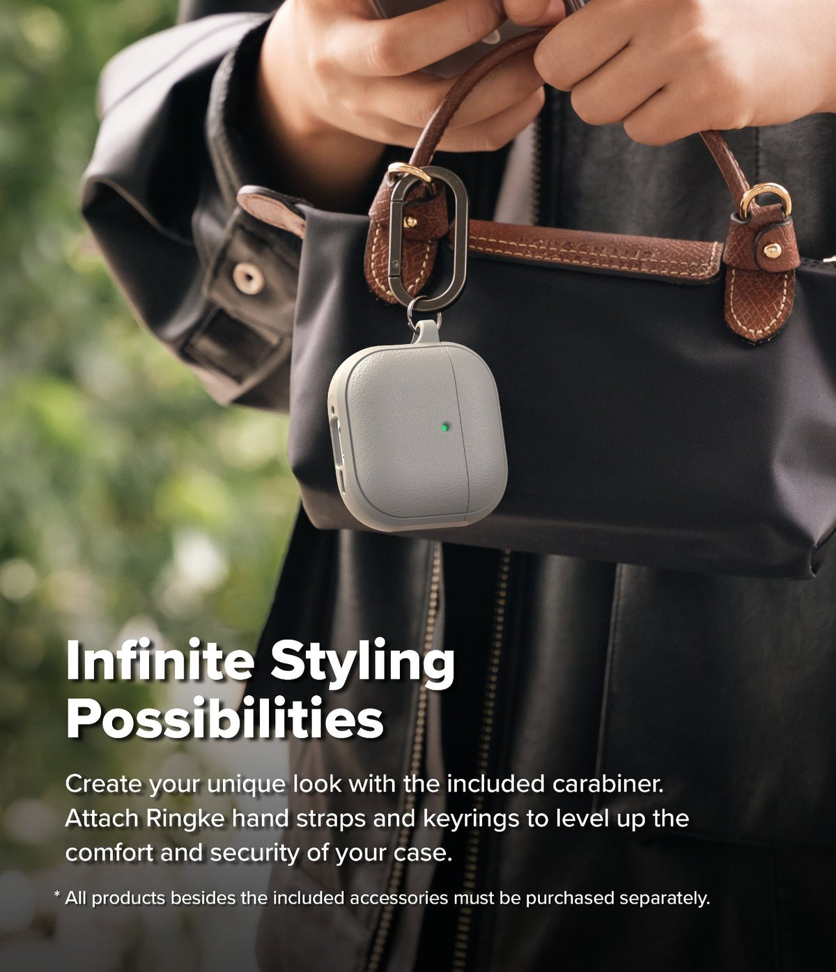 AirPods 5 / 4 Case | Onyx Magnetic - A grey AirPods 4 case with a carabiner hanging from a black handbag held by a person.
