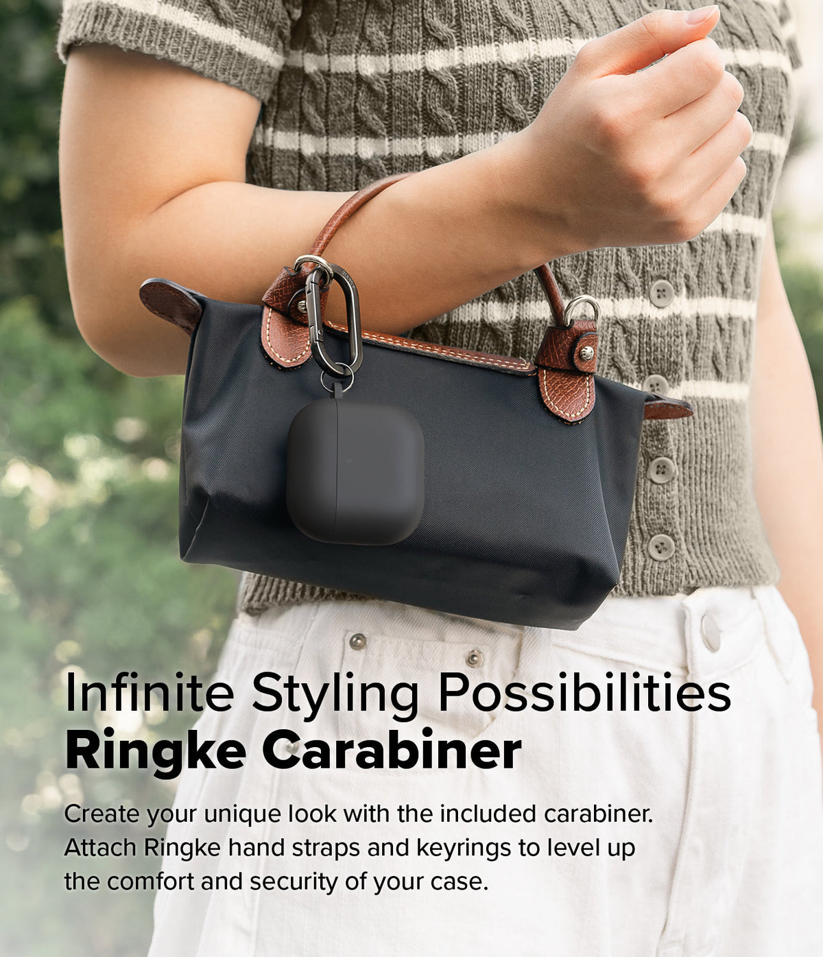 AirPods 5 / 4 Case | Silicone Case - AirPods 4 Case - Black silicone case attached to a handbag handle with a metal carabiner.