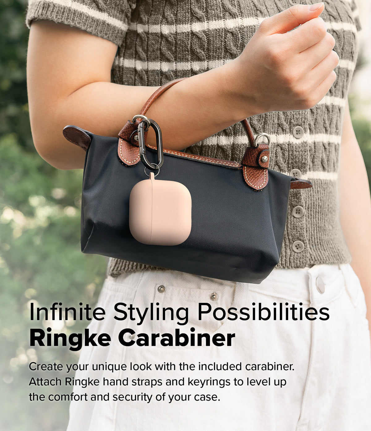AirPods 5 / 4 Case | Silicone Case - AirPods 4 Case - A pink silicone AirPods 4 case attached to a black handbag with a black metal carabiner.