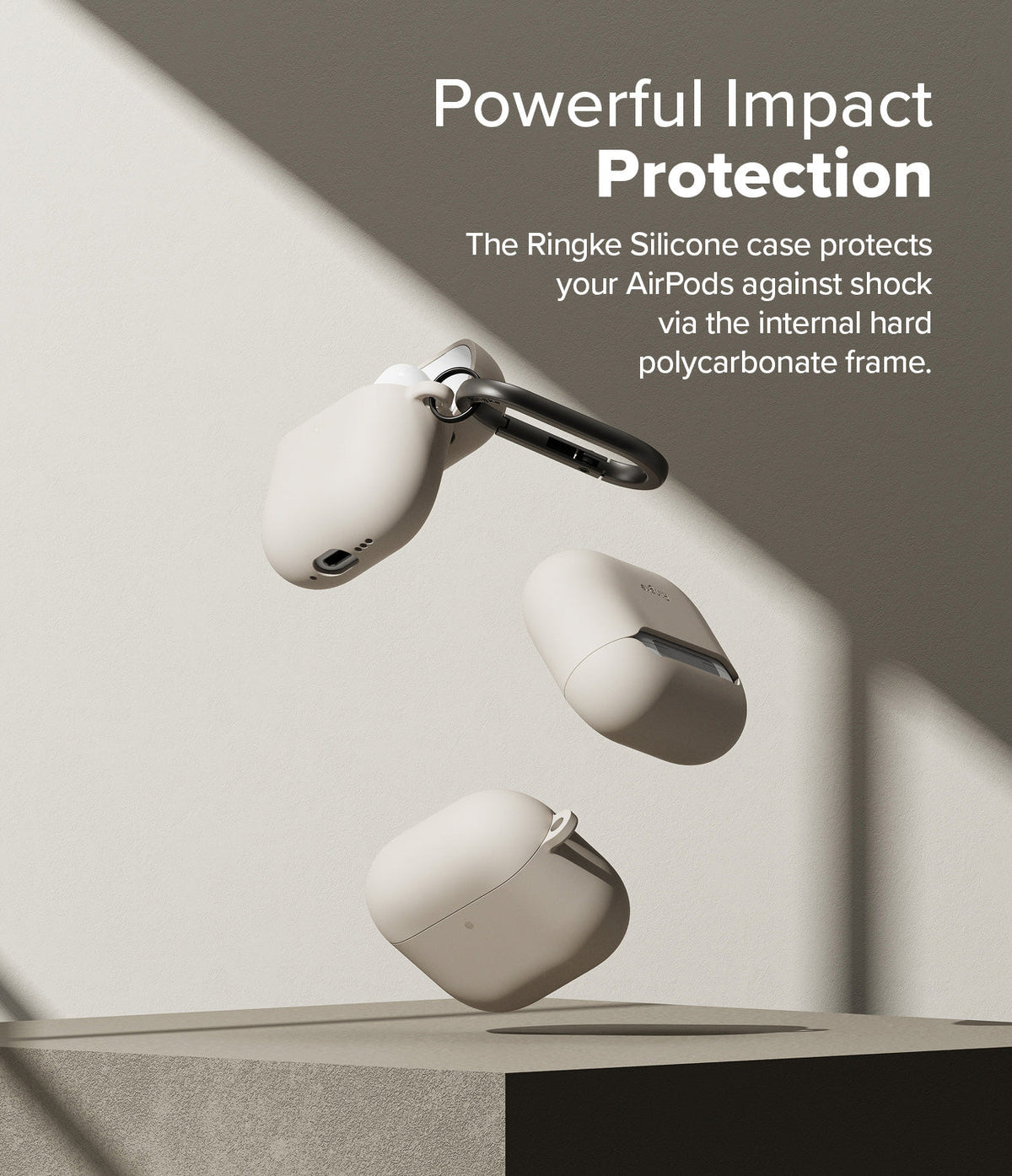 AirPods 5 / 4 Case | Silicone Case - AirPods 4 Case - Three beige silicone AirPods 4 cases floating against a neutral background with a black carabiner attached.