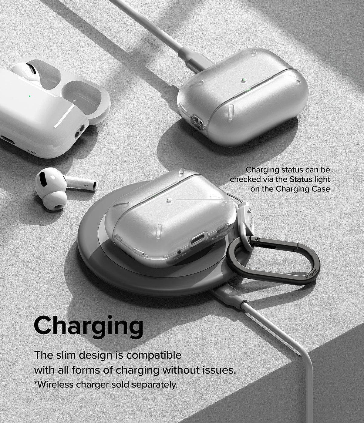 AirPods Pro 2 Case | Layered - Clear protective case on a wireless charging pad with AirPods and charging cable nearby.
