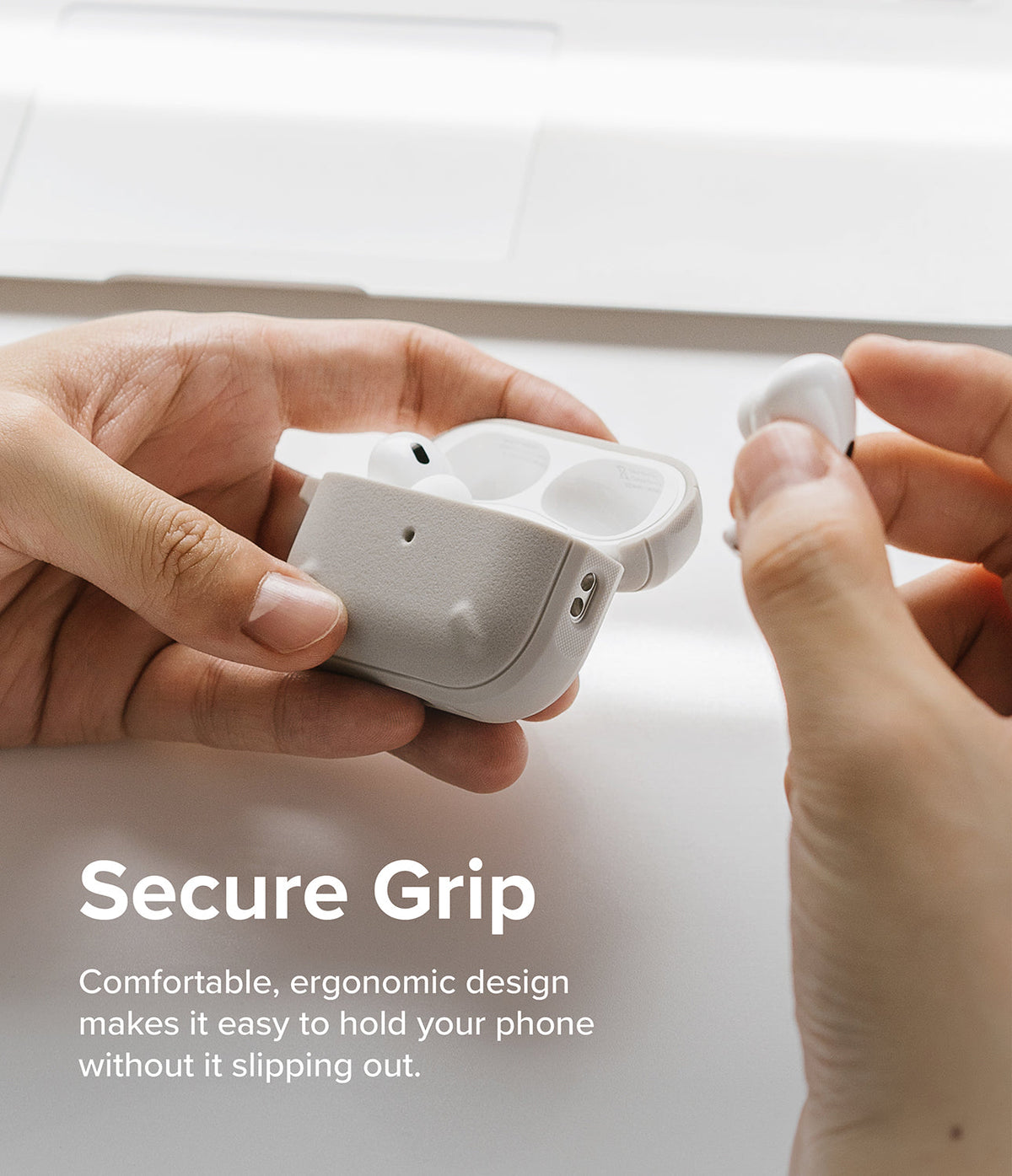 AirPods Pro 2 Case | Onyx - Hands holding an open, textured light gray AirPods Pro 2 case with one earbud being removed.