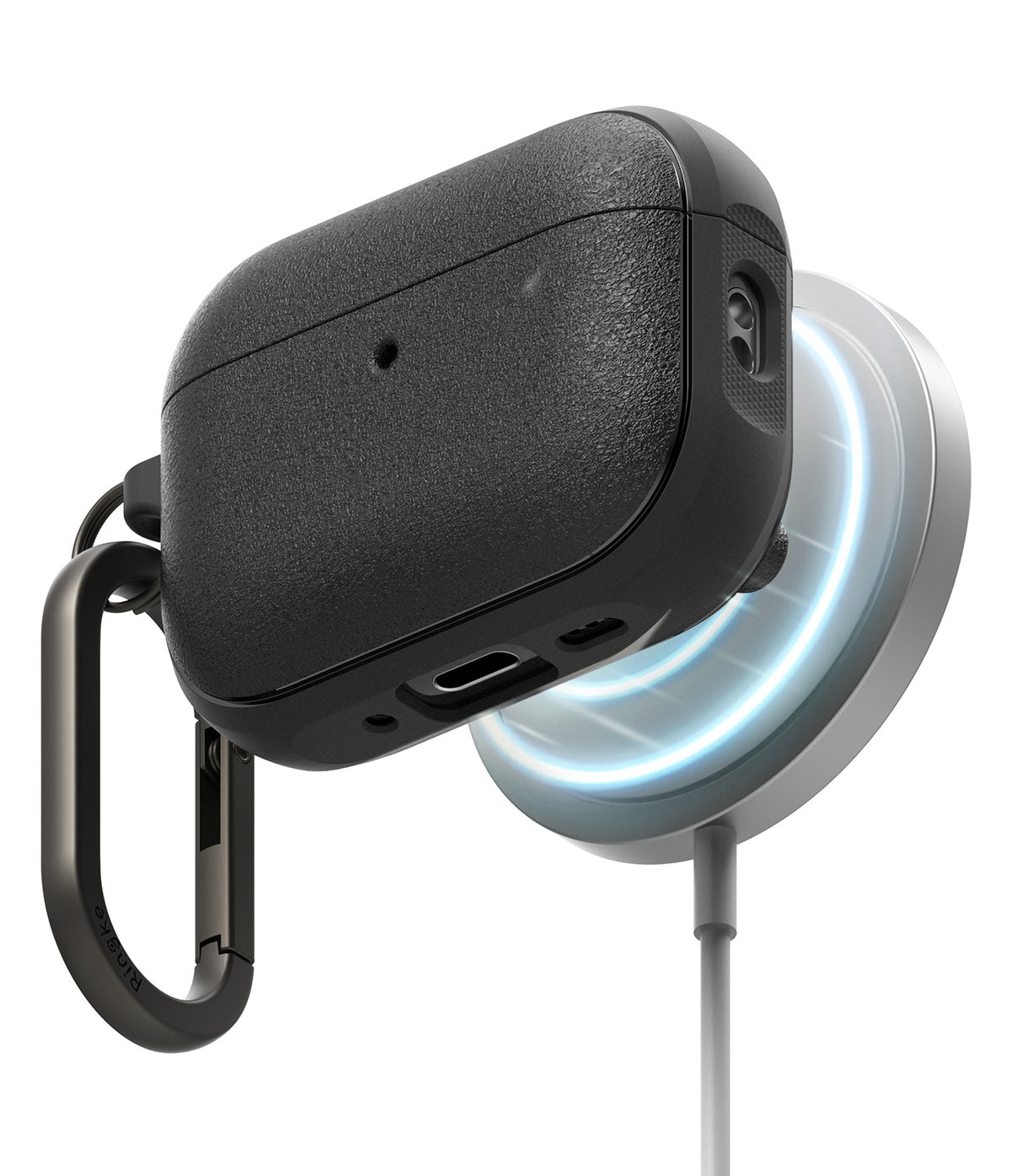AirPods Pro 3 Case | Onyx Magnetic - Textured black case charging on a magnetic wireless pad with a carabiner attached.