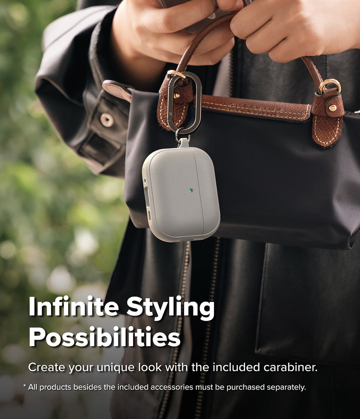 AirPods Pro 3 Case | Onyx Magnetic - Grey textured case clipped to a black handbag with a metal carabiner.