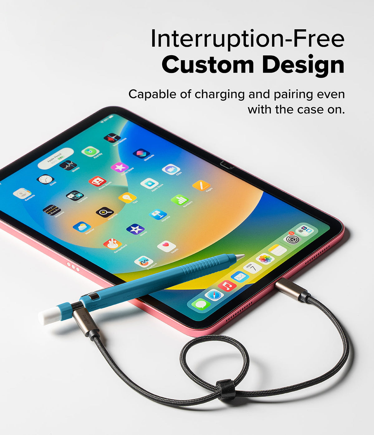 Apple Pencil USB-C Case | Silicone Drafting Pencil Case - Apple Pencil USB-C Case - Blue silicone case on an Apple Pencil charging via USB-C cable next to a pink iPad.