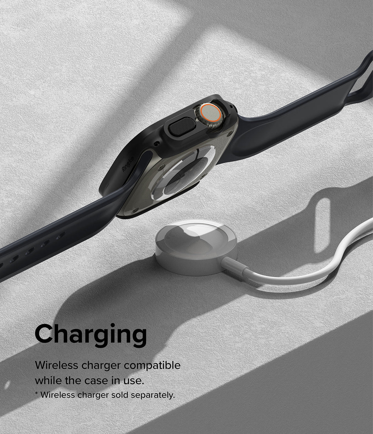 Apple Watch Ultra 3 / 2 / 1 Case | Slim - Apple Watch Ultra in a slim black case resting above a wireless charging puck.
