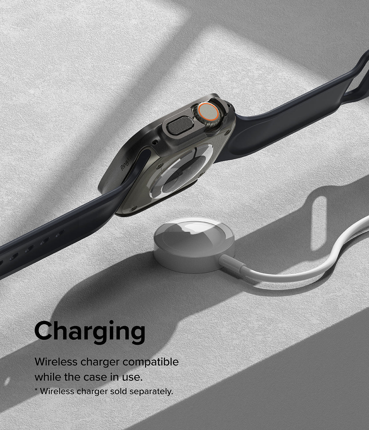 Apple Watch Ultra 3 / 2 / 1 Case | Slim - Apple Watch Ultra in a slim black case hovering above a wireless charging puck.