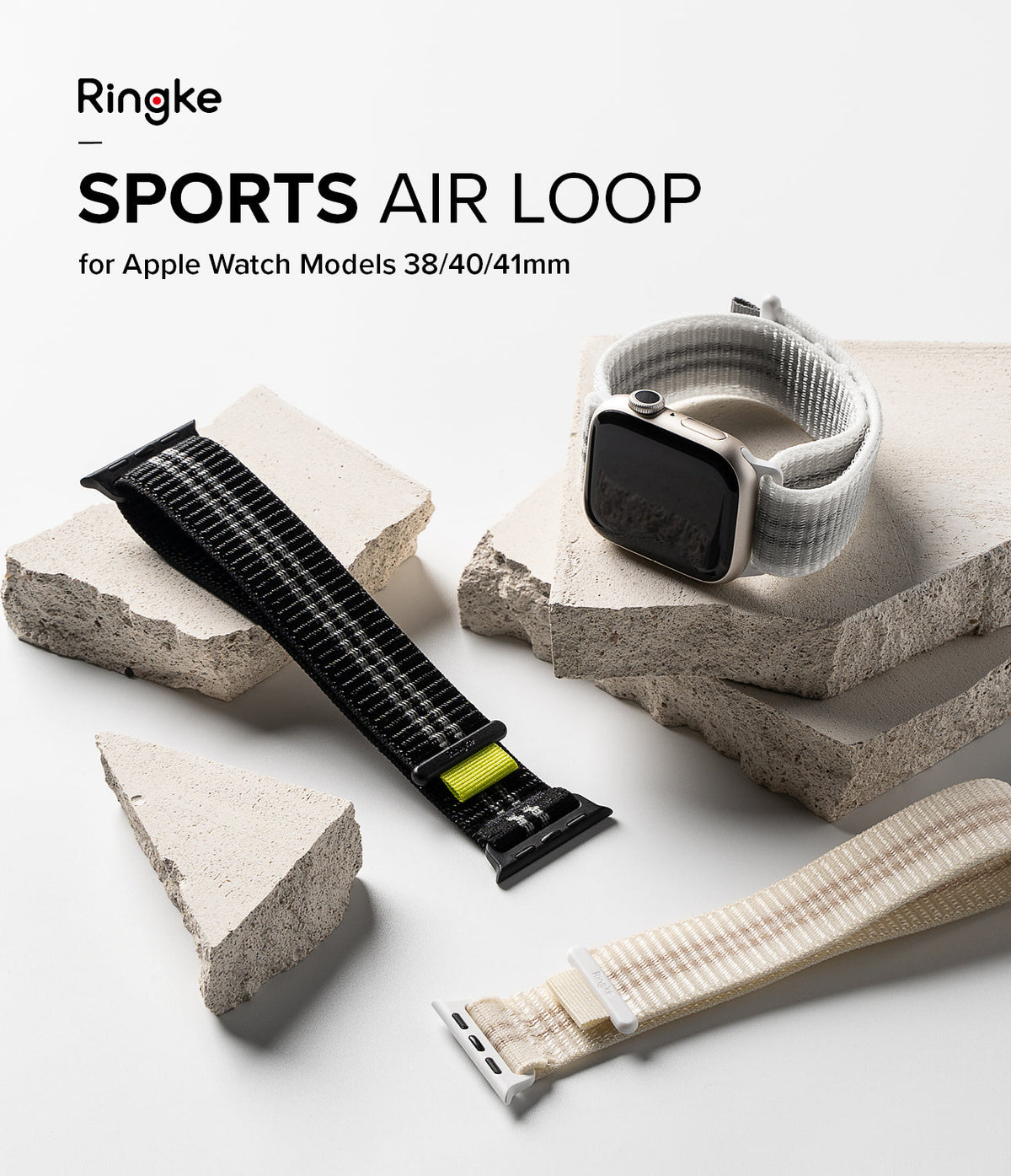 Apple Watch 42·41·40·38 mm | Sports Air Loop - Apple Watch with white strap on stone blocks, next to black and beige straps.