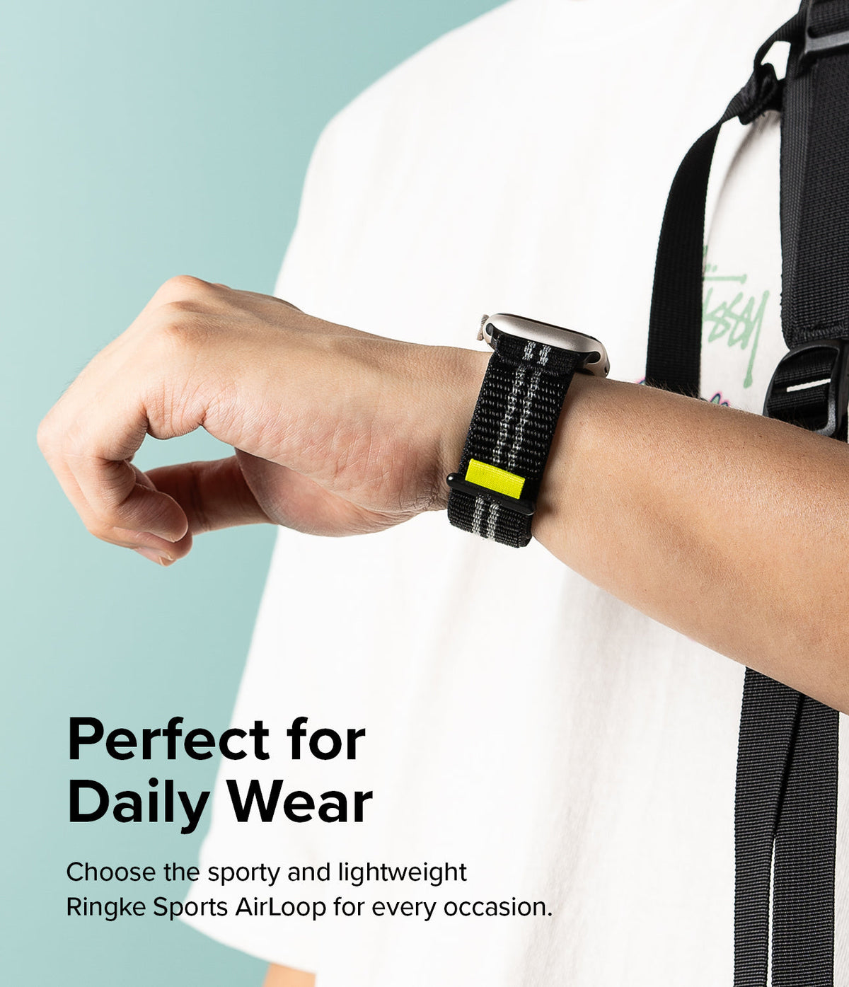 Apple Watch 42·41·40·38 mm | Sports Air Loop - Person wearing a black woven watch band with a neon yellow accent tab.
