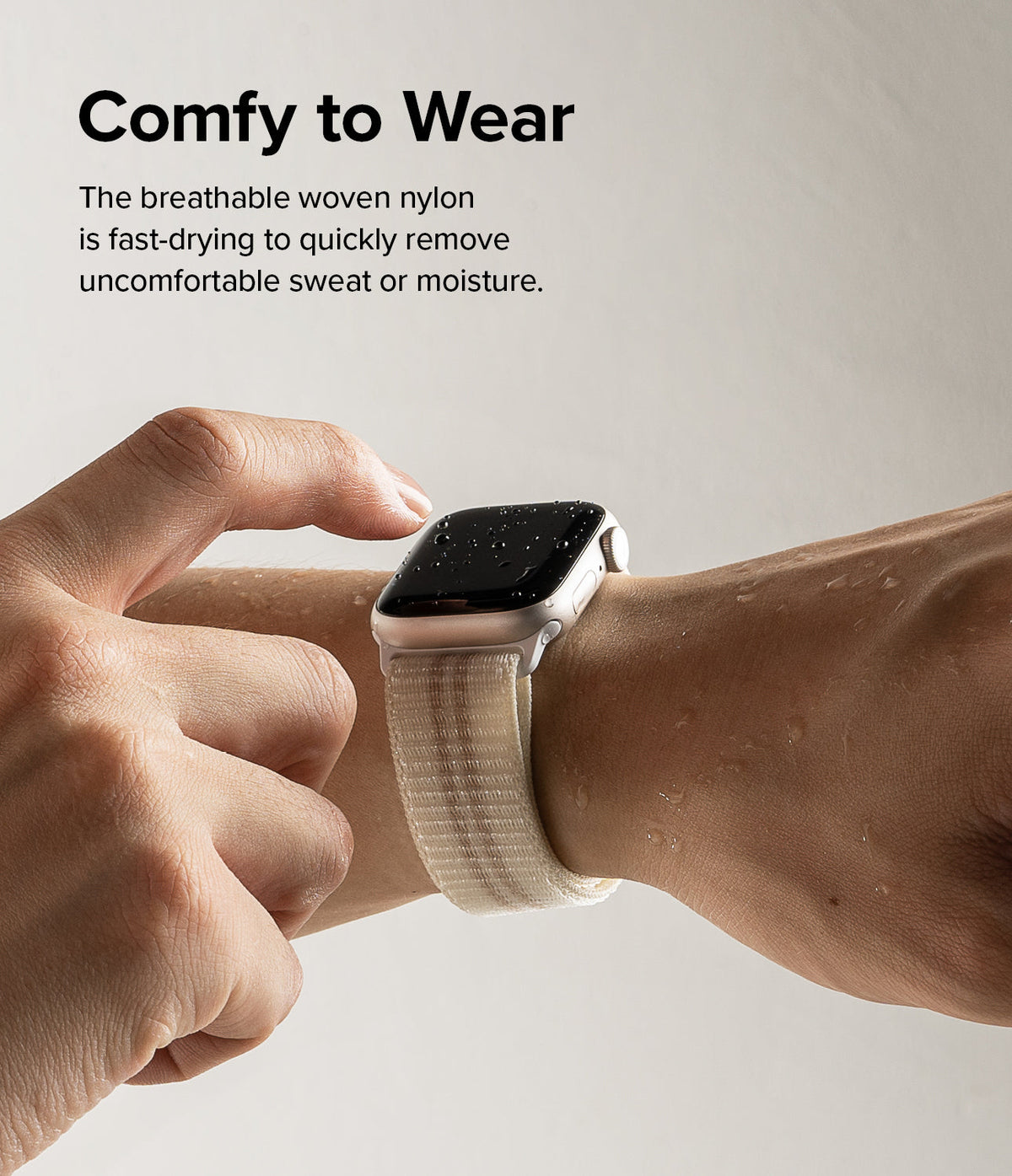 Apple Watch 42·41·40·38 mm | Sports Air Loop - A wet Apple Watch with a beige woven nylon band on a wrist.