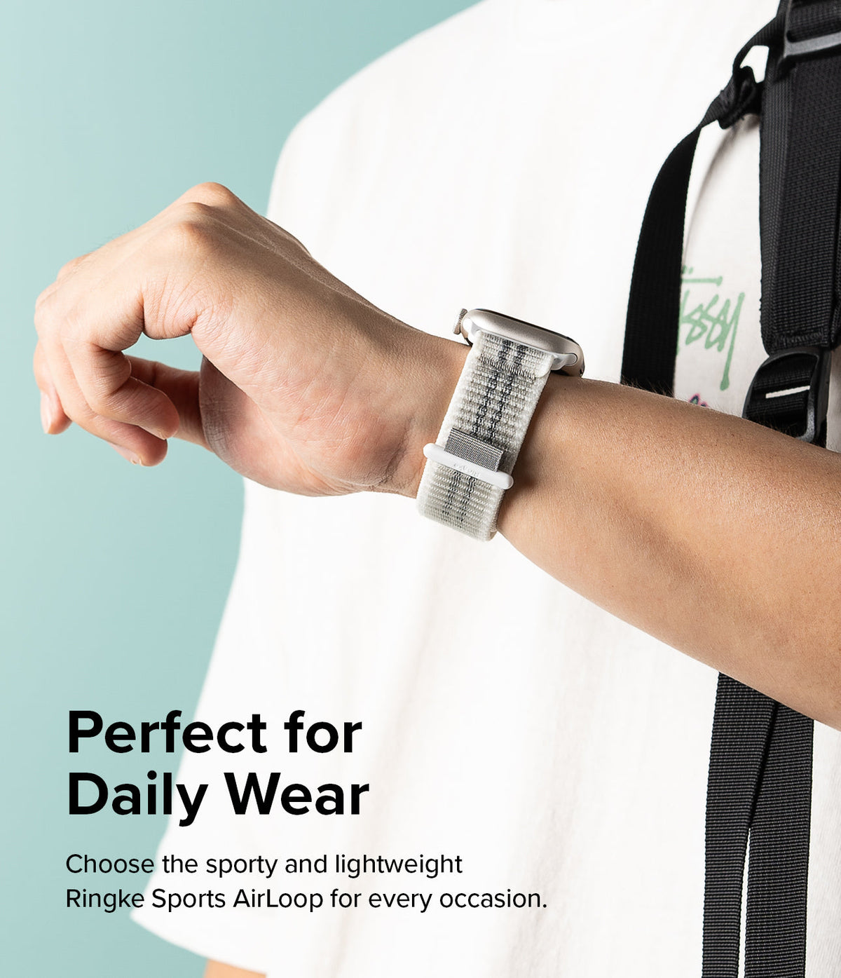 Apple Watch 42·41·40·38 mm | Sports Air Loop - Person wearing a white woven sports watch band on their wrist.