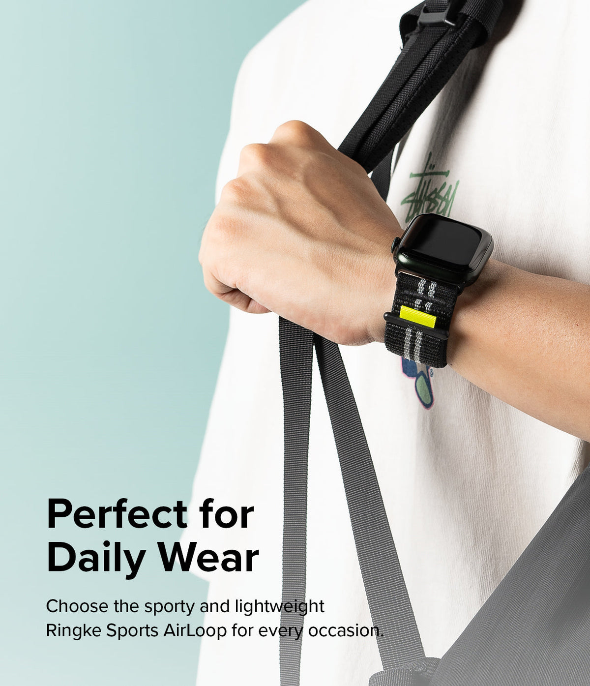Apple Watch 49·46·45·44·42 mm | Sports Air Loop - Person wearing a black Apple Watch with a black and grey striped fabric band.