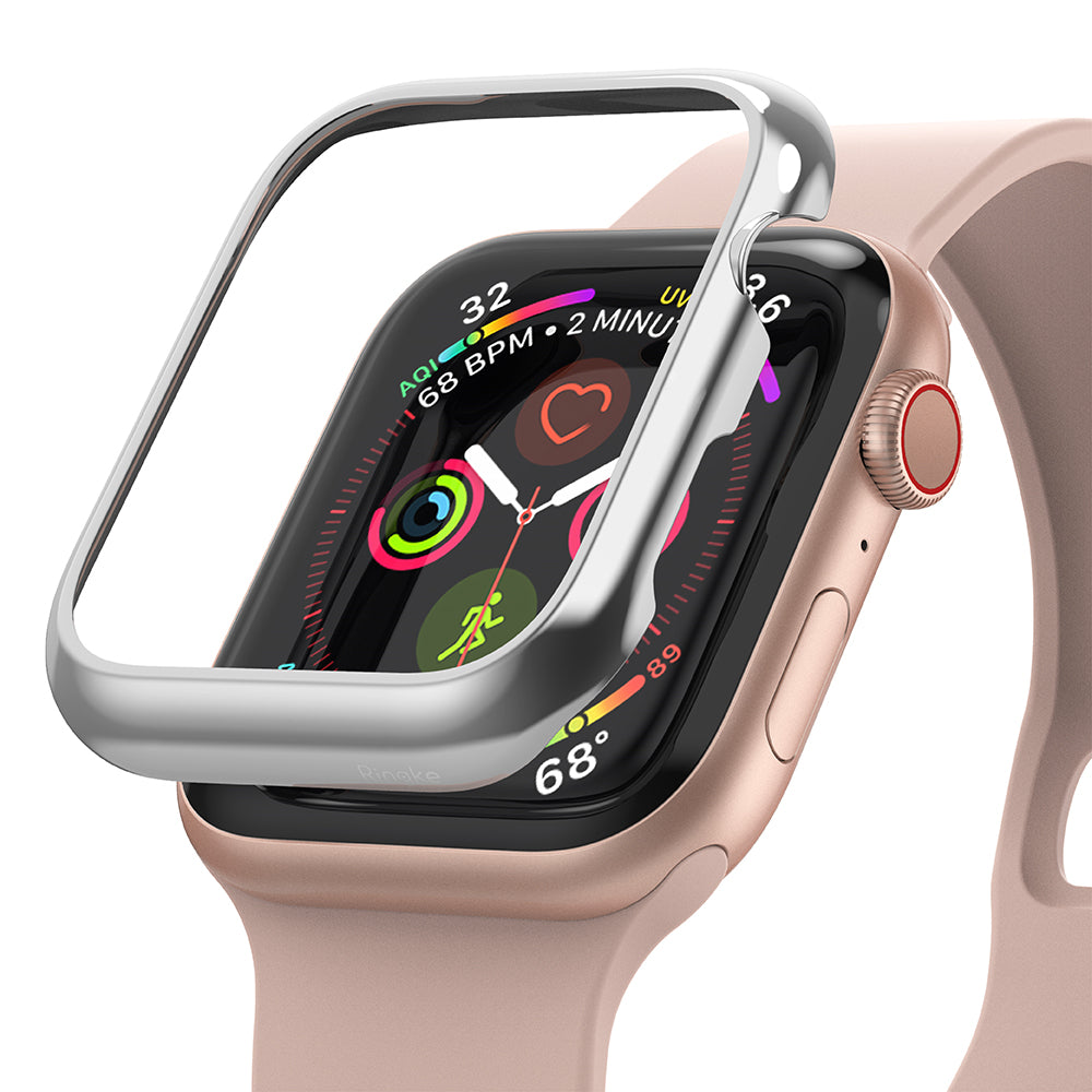 Apple Watch Series 6 / 5 / 4 / SE (44mm) | Bezel Styling - Silver protective bezel hovering over a pink Apple Watch.