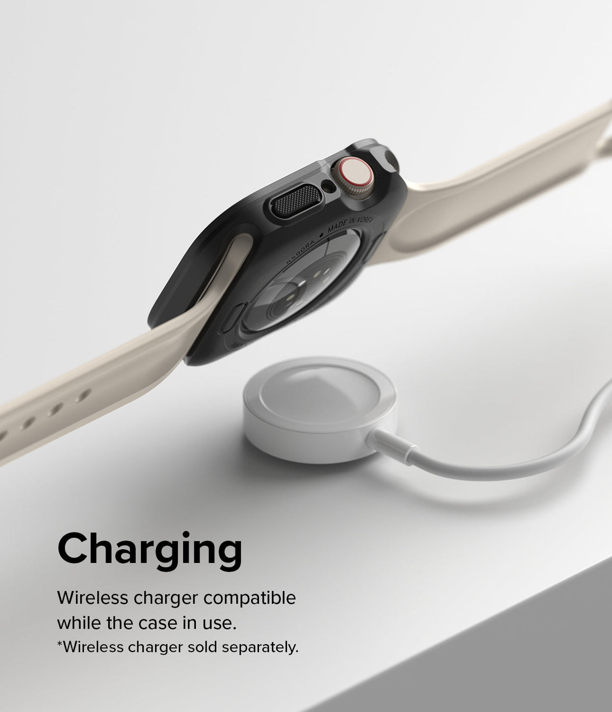 Apple Watch Series (45mm / 44mm) Case | Air Sports - Black protective case on Apple Watch hovering over a wireless charger.