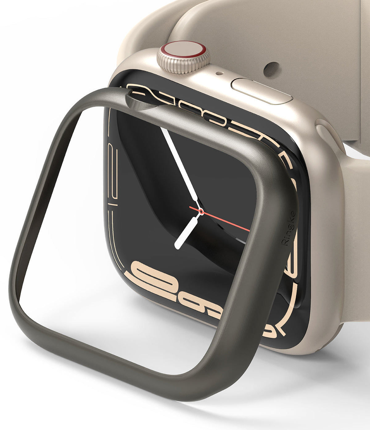 Apple Watch 9 / 8 / 7 (45mm) | Bezel Styling - A dark metallic bezel cover being placed over a beige Apple Watch.