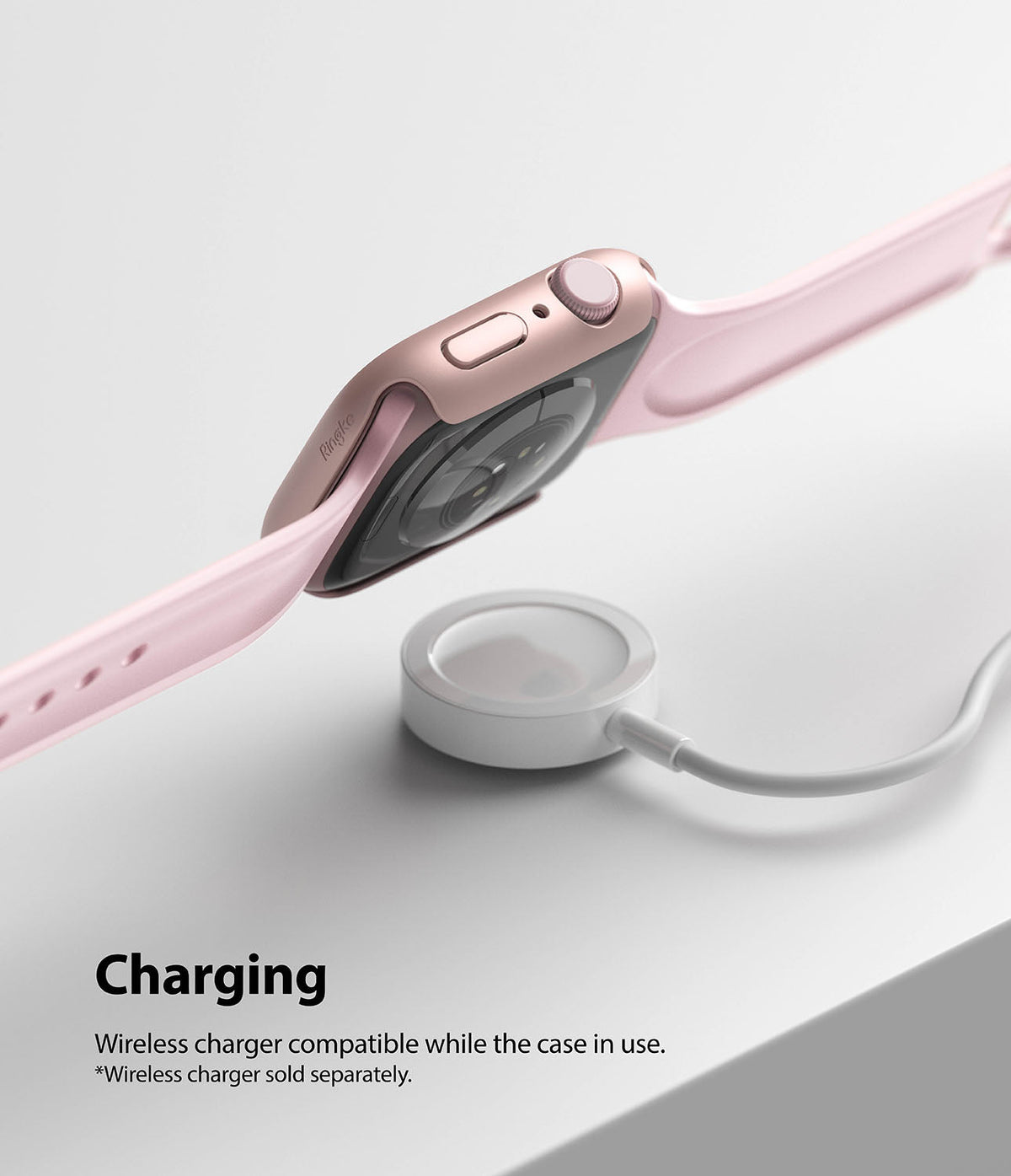 Apple Watch 9 / 8 / 7 (41mm) | Slim - Pink Apple Watch with slim case hovering above a white wireless charging puck.