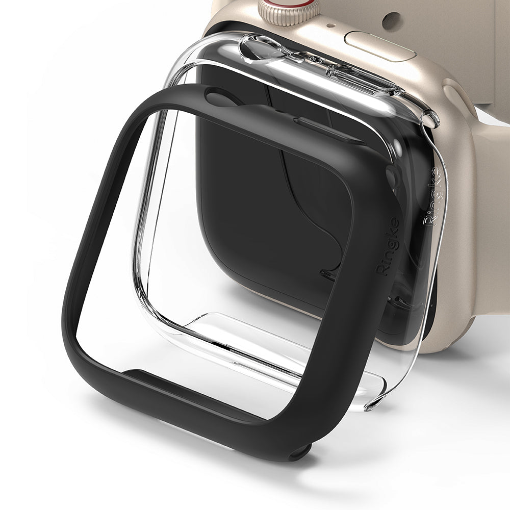 Apple Watch 9 / 8 / 7 (41mm) | Slim - A black protective bumper case hovering in front of a gold Apple Watch.