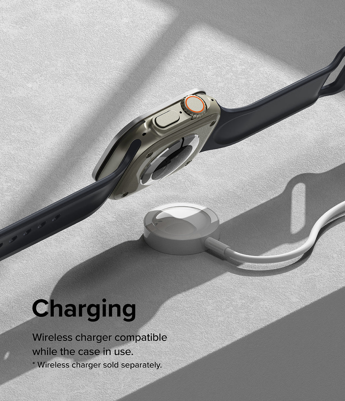 Apple Watch Ultra 3 / 2 / 1 | Glass + Bezel Styling Combo - Apple Watch Ultra with protective case hovering over a wireless charger.
