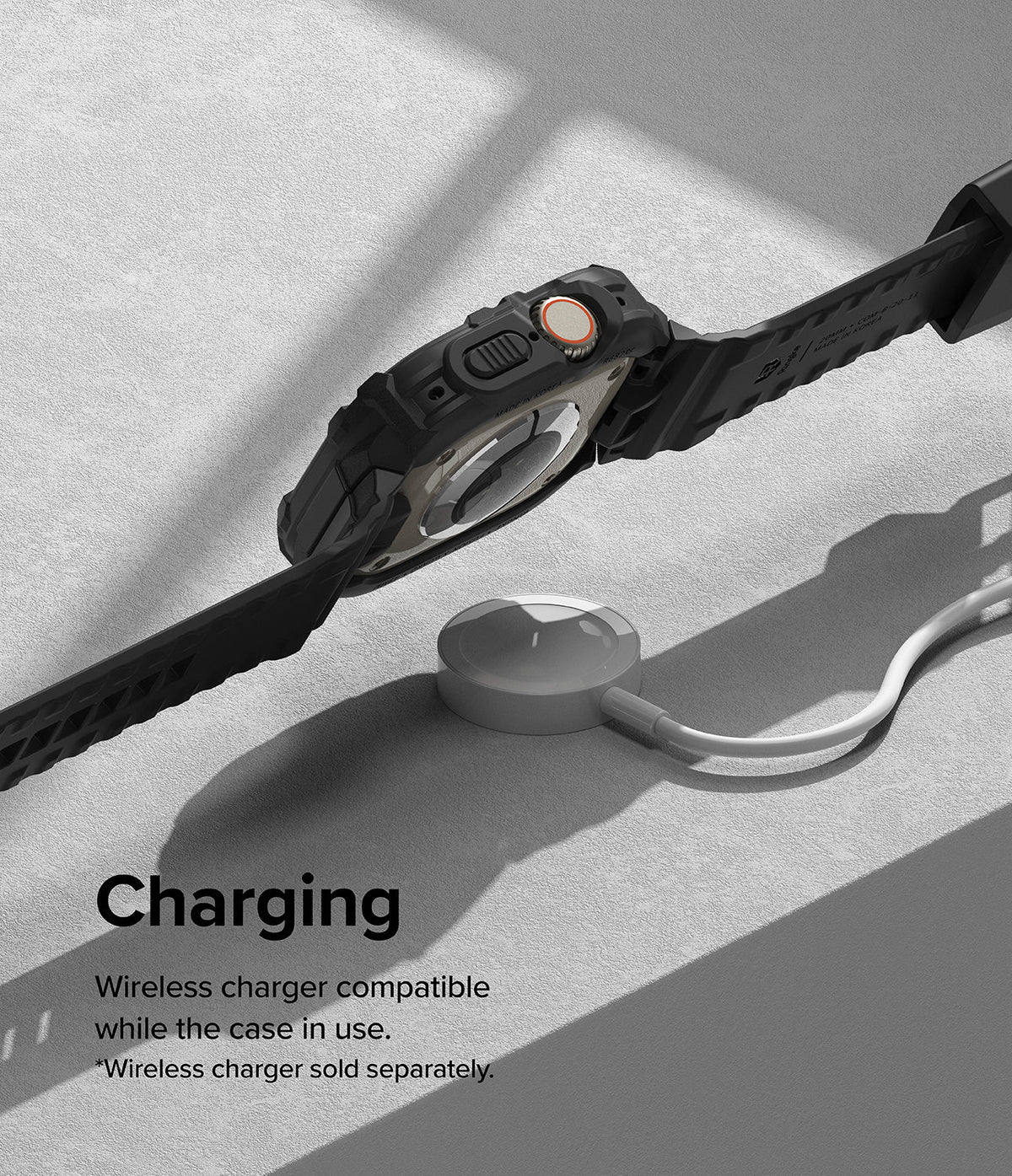 Apple Watch Ultra 3 / 2 / 1 Case + Band | Fusion-X Guard - Apple Watch Ultra in a black rugged case charging wirelessly.