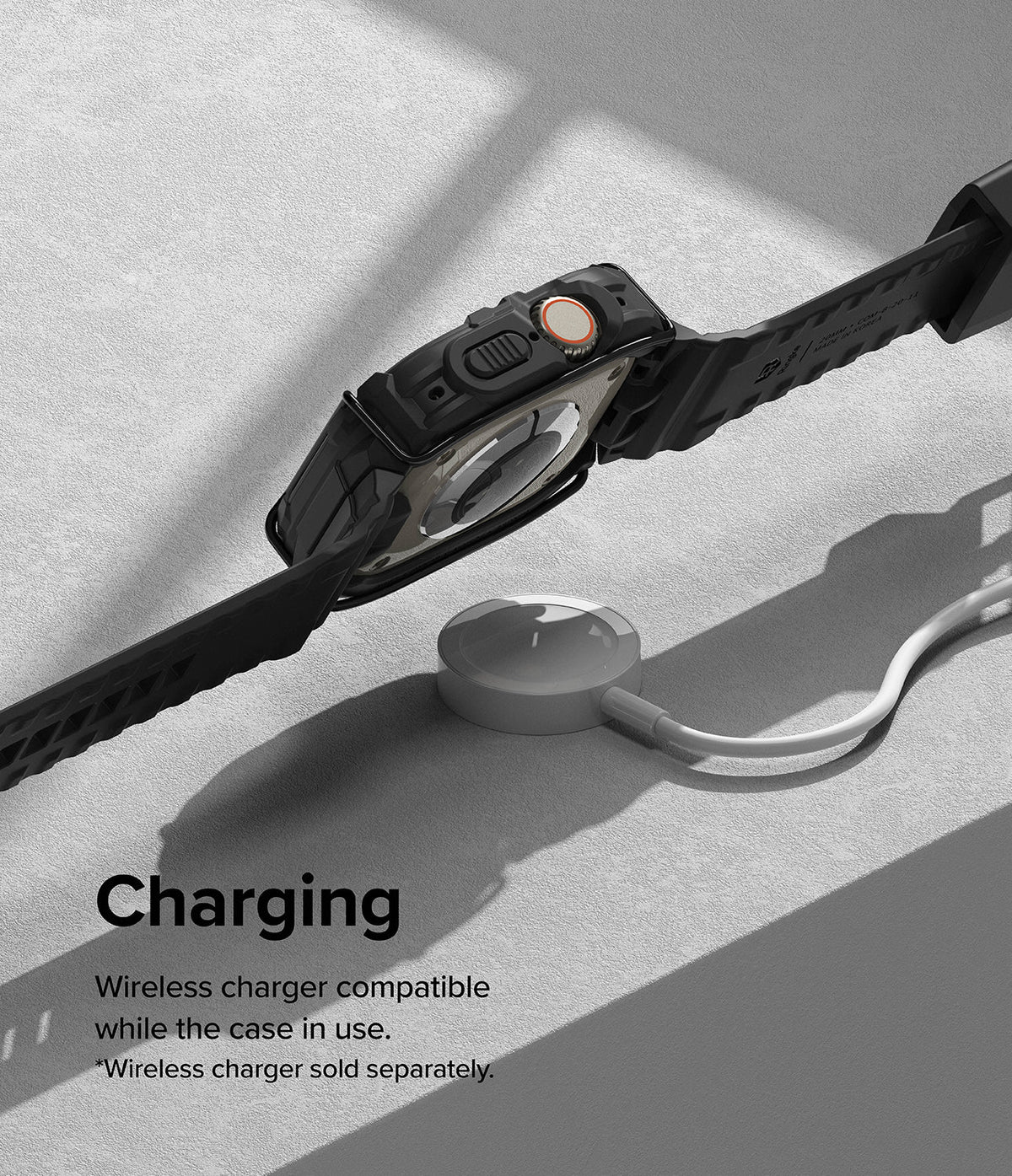 Apple Watch Ultra 3 / 2 / 1 Case + Band | Fusion-X Guard - Apple Watch Ultra in a black protective case charging wirelessly.