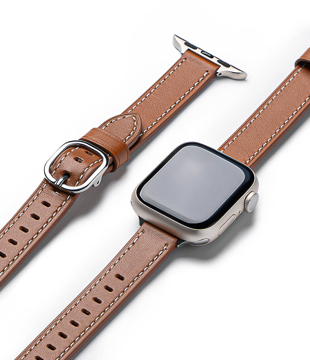 Apple Watch 42·41·40·38 mm | Leather One Slim Band - Tan leather watch band with white stitching and silver buckle.