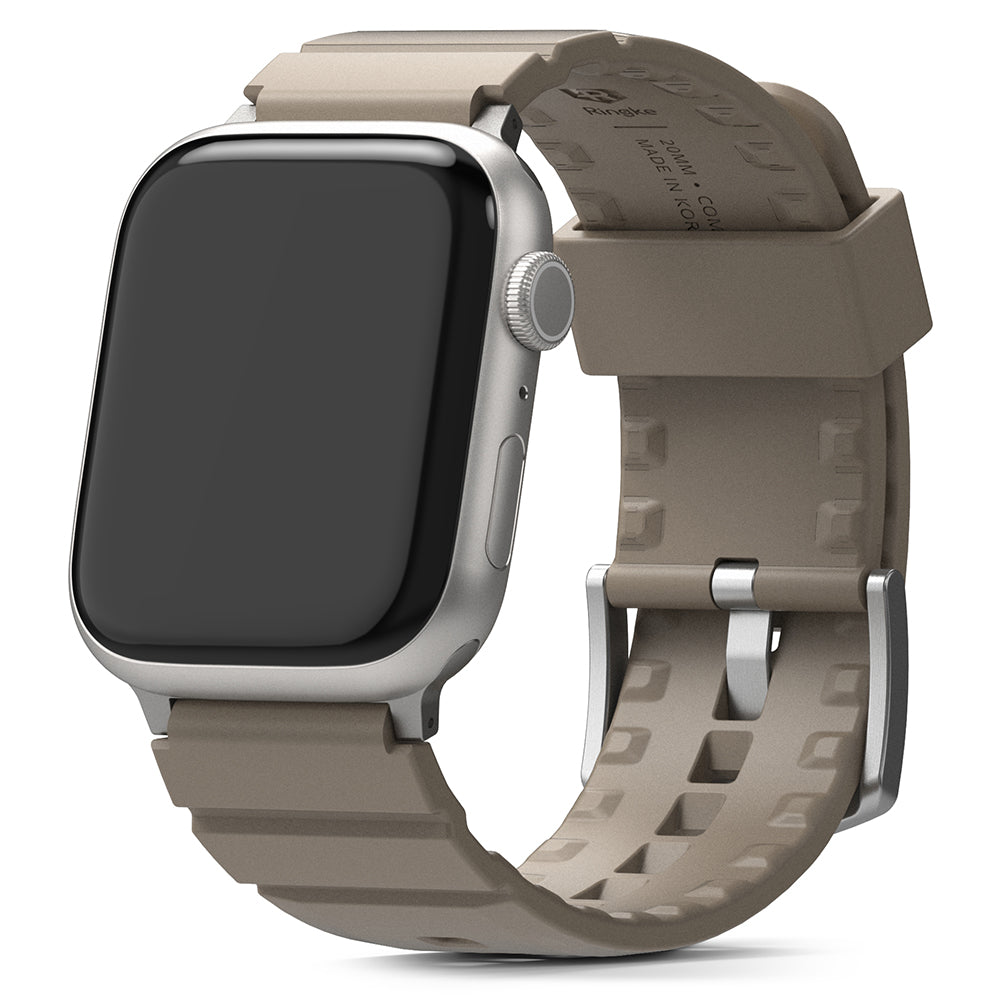 Apple Watch 49·46·45·44·42mm | Rubber One Bold Band - Silver Apple Watch with a textured, taupe-colored rubber strap.